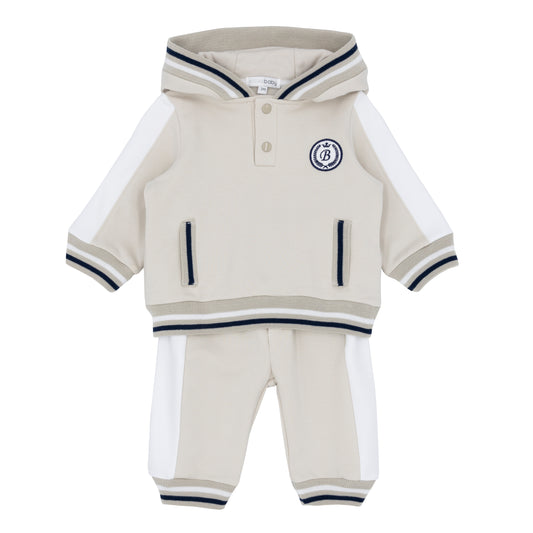 Children's beige and white outfit with a logo 