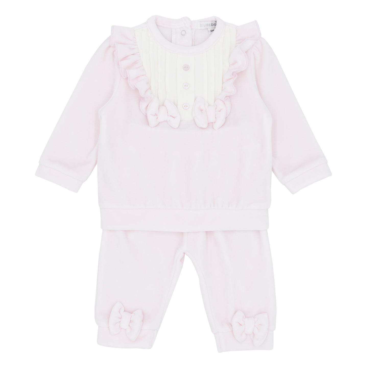 White baby romper with ruffled details on a white background