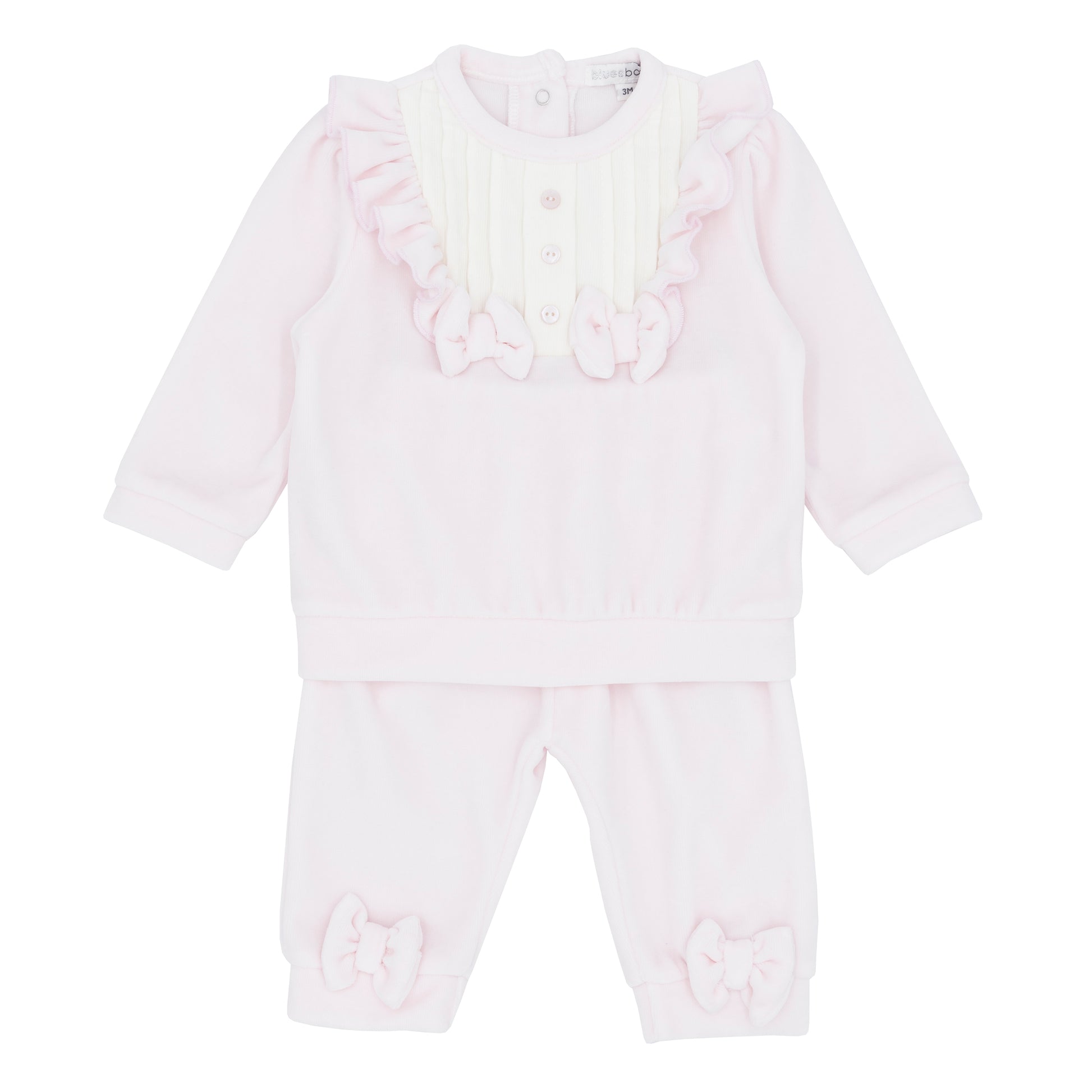 White baby romper with ruffled details on a white background